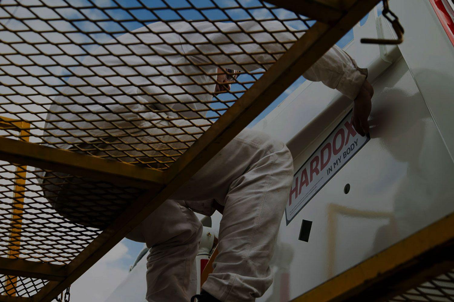 Hardox® sign on white container.