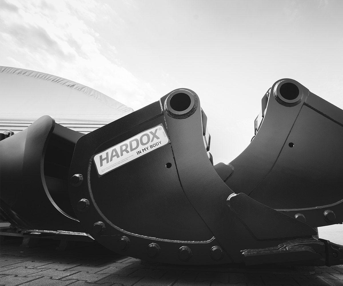 Black and white image of two Hardox In My Body excavator buckets.